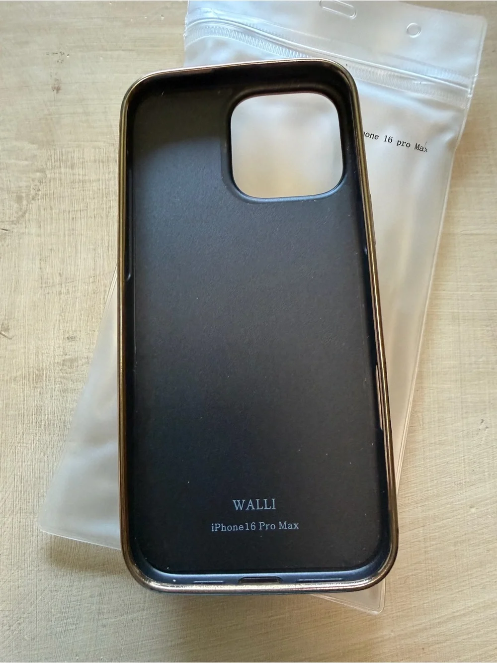 Sleek Black Wallet Phone Case with Gold Trim for iPhone 16 Pro Max
